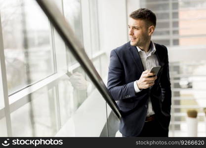 Businessman holding telephonphone in the office