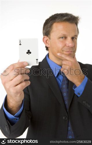 Businessman Holding The Ace Of Clubs