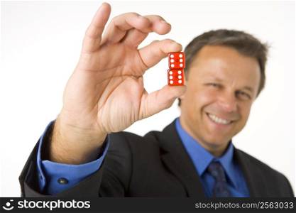 Businessman Holding Two Red Dice