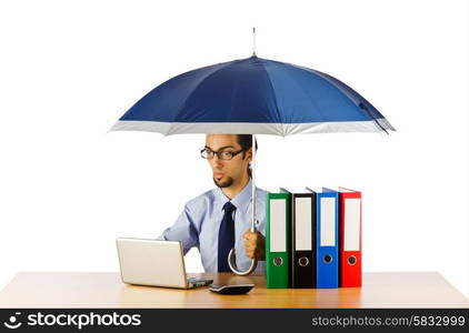 Businessman holding umbrella in the office