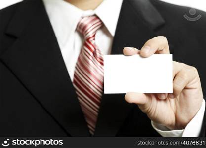 Businessman holding up a blank business card