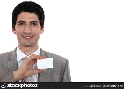 Businessman holding up his business card