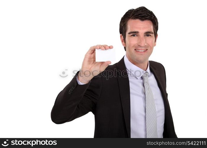 Businessman holding up his business card