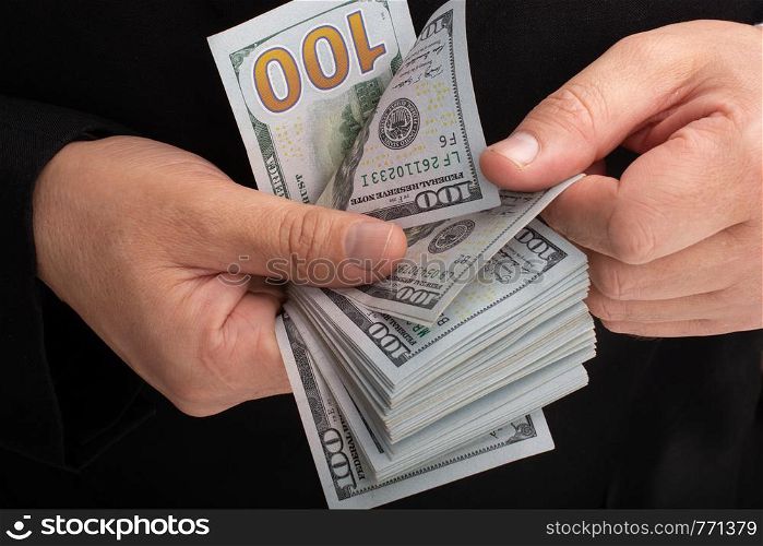 Businessman holding US dollar banknote money on white background
