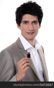 Businessman holding USB stick