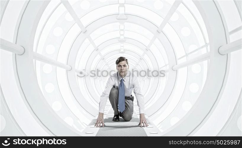 Businessman in 3D room mixed media. Young businessman running in futuristically designed tunnel