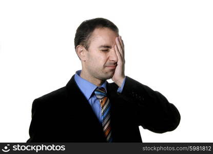 Businessman in a suit gestures with a headache