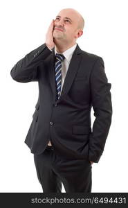 Businessman in a suit gestures with a headache, isolated. headache