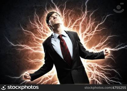 businessman in anger. businessman in anger with fists clenched screaming