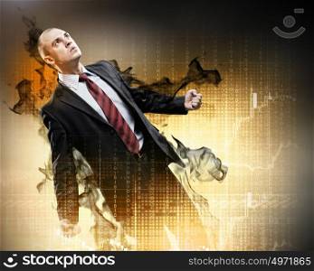 Businessman in anger. Image of young businessman in anger standing in black smoke