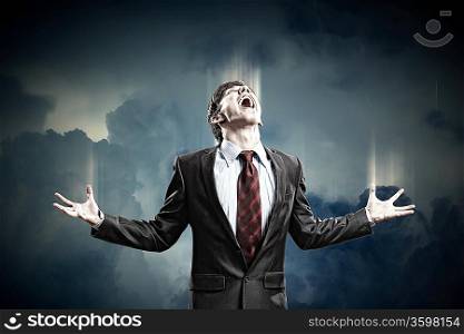 businessman in anger screaming against cloudy background