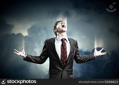 businessman in anger screaming against cloudy background