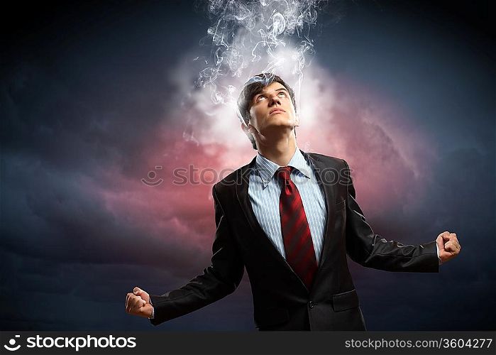 businessman in anger with fists clenched and steam above head