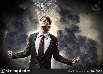 businessman in anger with fists clenched and steam above head