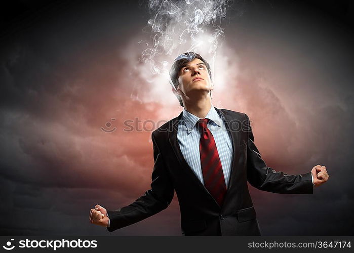 businessman in anger with fists clenched and steam above head