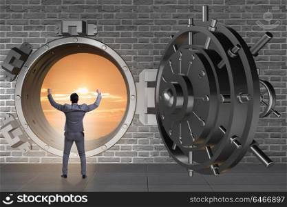 Businessman in banking concept with vault door