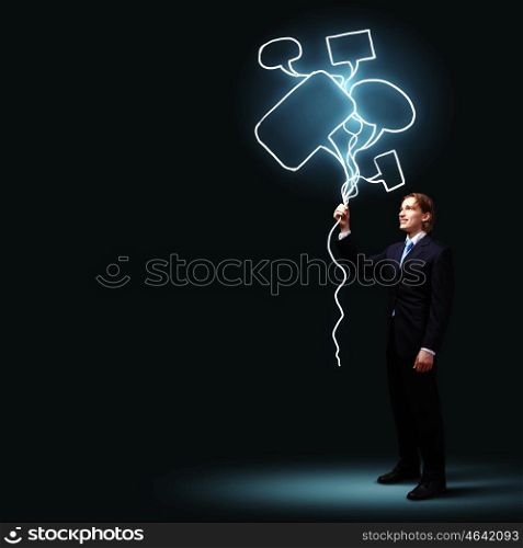 Businessman in black suit. Image of businessman in black suit against dark background