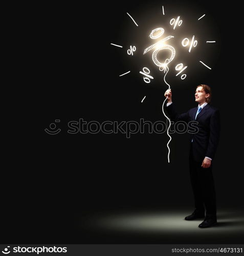 Businessman in black suit. Image of businessman in black suit against dark background