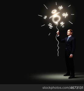 Businessman in black suit. Image of businessman in black suit against dark background