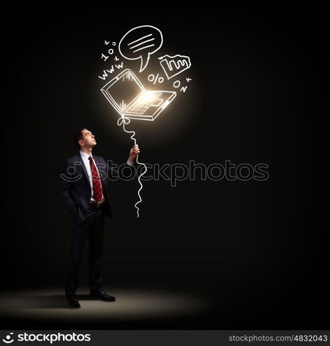 Businessman in black suit. Image of businessman in black suit against dark background