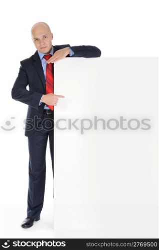 Businessman in black suit with large blank. Isolated on white background
