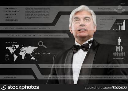 Businessman in black suit working with digital vurtual screen