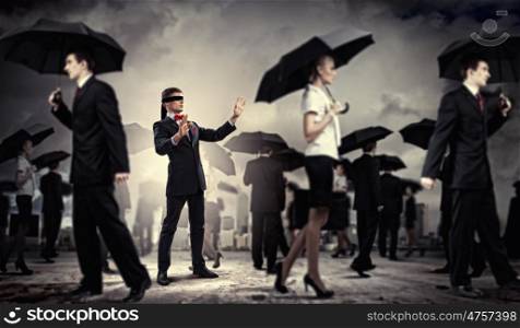 Businessman in blindfold among group of people. Image of businessman in blindfold walking among group of people