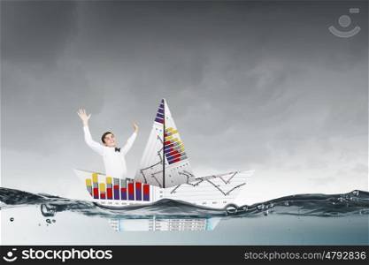 Businessman in boat made of paper. Successful businessman sailing on paper boat in financial sea