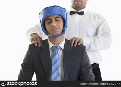 Businessman in boxing gear getting a massage