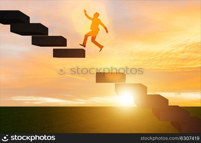 Businessman in career promotion concept with stairs