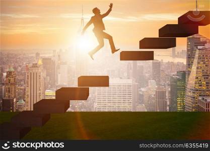 Businessman in career promotion concept with stairs