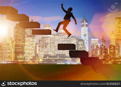 Businessman in career promotion concept with stairs
