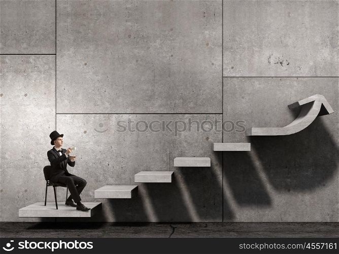 Businessman in cylinder drinking coffee. Businessman taking break and having cup of hot aromatic coffee