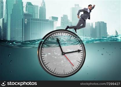 Businessman in deadline and time management concept