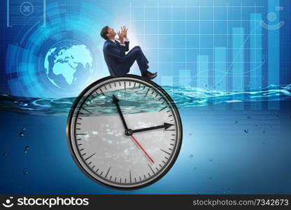 Businessman in deadline and time management concept