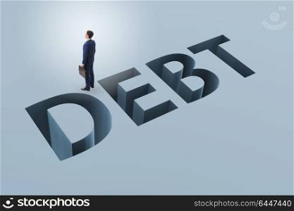 Businessman in debt and borrowing concept