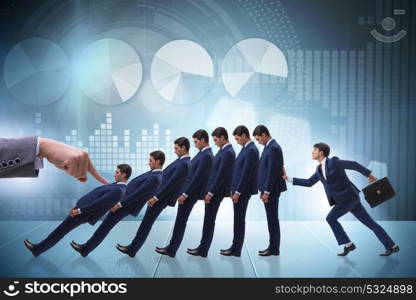 Businessman in domino effect business concept