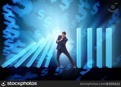 Businessman in domino effect business concept