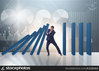 Businessman in domino effect business concept