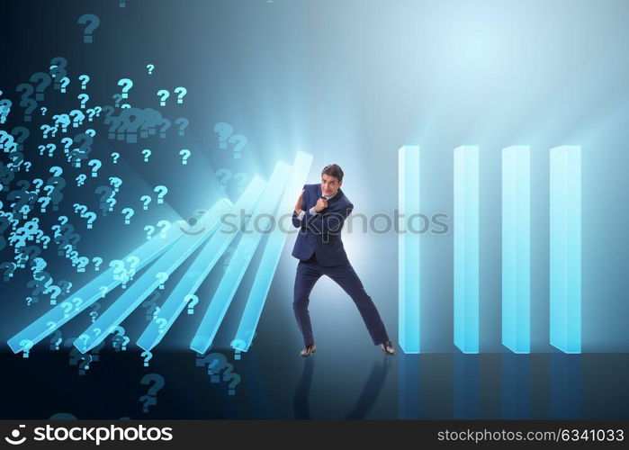 Businessman in domino effect business concept