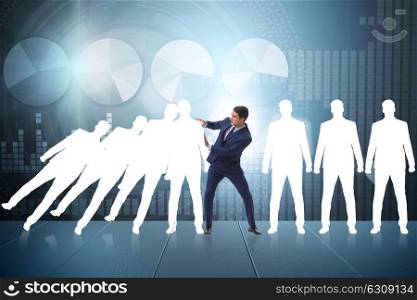 Businessman in domino effect business concept. The businessman in domino effect business concept
