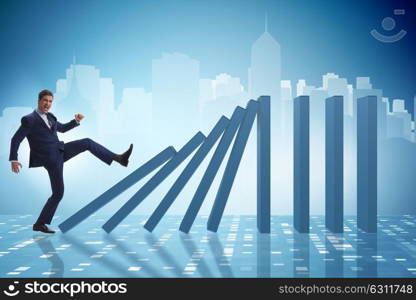 Businessman in domino effect business concept. The businessman in domino effect business concept