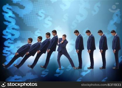 Businessman in domino effect business concept. The businessman in domino effect business concept