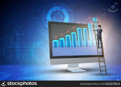 Businessman in economic forecasting concept with charts