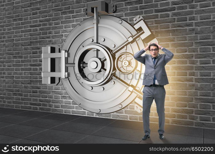 Businessman in front of banking vault door