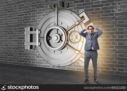 Businessman in front of banking vault door