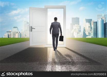 Businessman in front of door in business opportunities concept