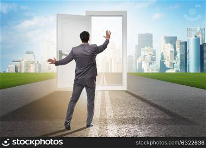 Businessman in front of door in business opportunities concept. The businessman in front of door in business opportunities concept