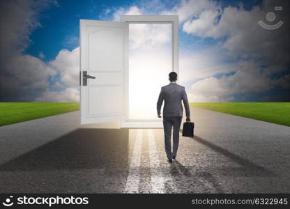 Businessman in front of door in business opportunities concept