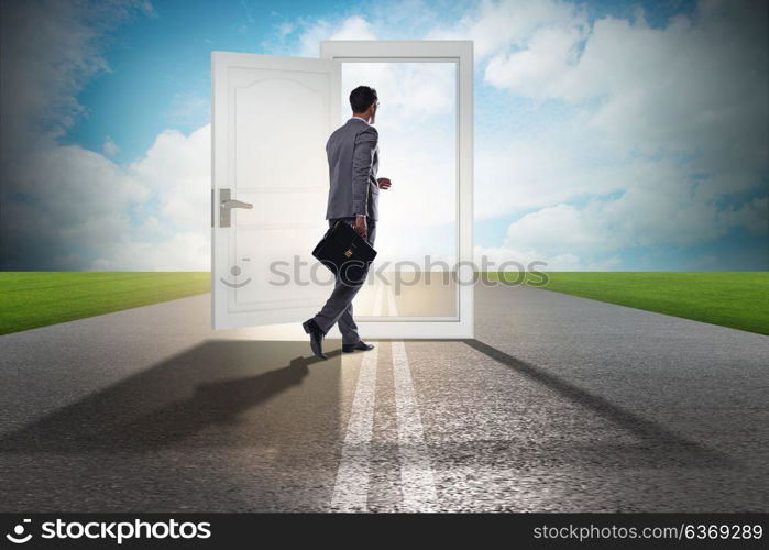 Businessman in front of door in business opportunities concept